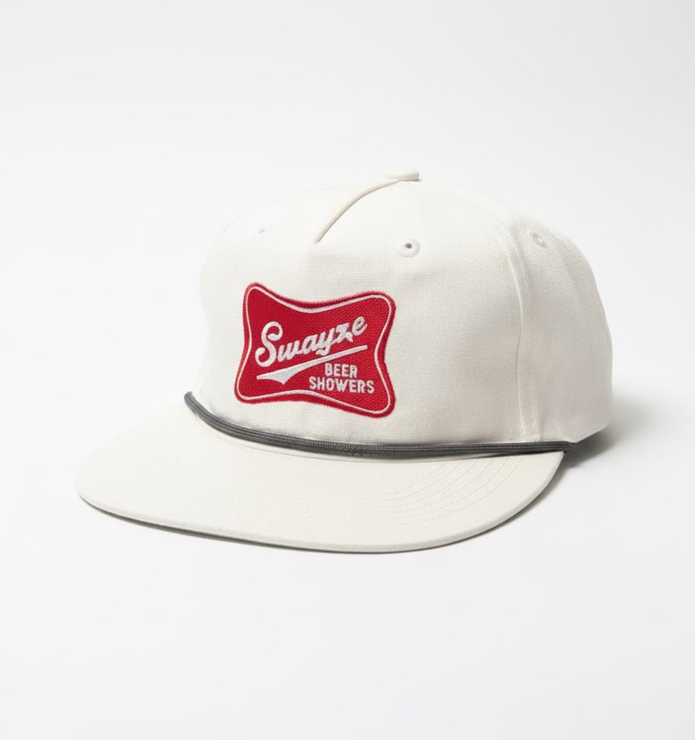 Front view of Swayze Beer Showers on an red Miller Logo patch sewn onto a white baseball hat